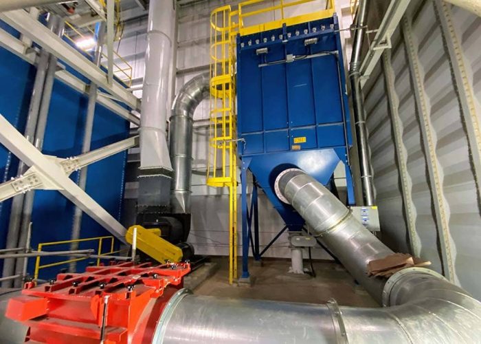 View on the 2nd floor of the isolation valve feeding into the dust collector. Isolation valve and dust collector