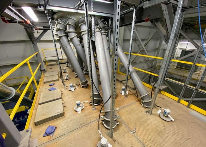 Rotary distributor feeding into green bean silos (before decaffeination process). Rotary distributor feeding green bean silos