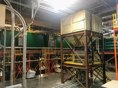 Roasted coffee storage mezzanine with blender below.