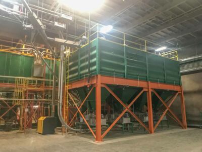 Another view of green bean storage silos. Weigh belts under the silos measure out exact amounts of coffee leaving to silos continuously, allowing for most efficient batching possible.