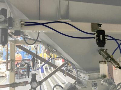 View from under the post-roast mezzanine, after coffee has been blended. A sampling device (highlighted) allows for convenient quality control before transport to supersack filling or final packaging. Sample Taking Device